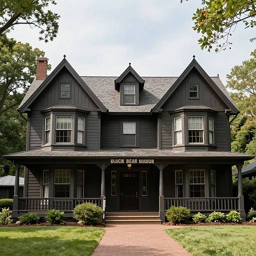Photograph of a black Victorian-style house with 