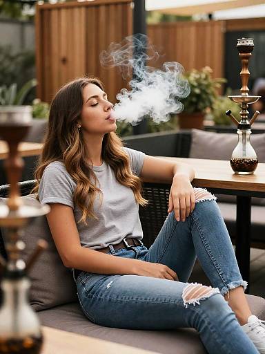 Woman Relaxing and Smoking Shisha Outdoors