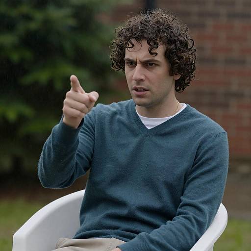 Man in Sweater Captured in Rain