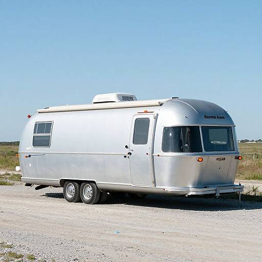 Silver Airstream Trailer on Gravel Road