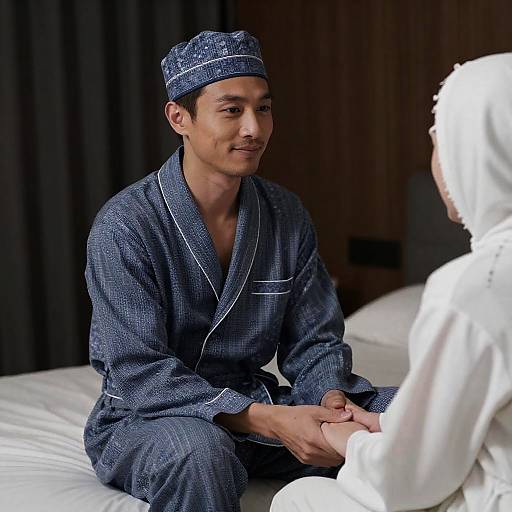 Man in Blue Pajamas Holding Hands