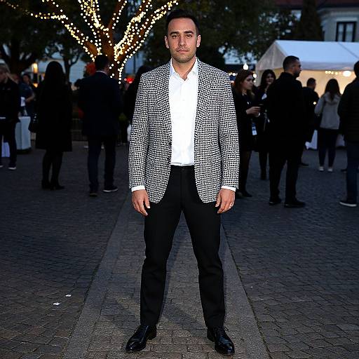 Man on Cobblestone at Evening Event