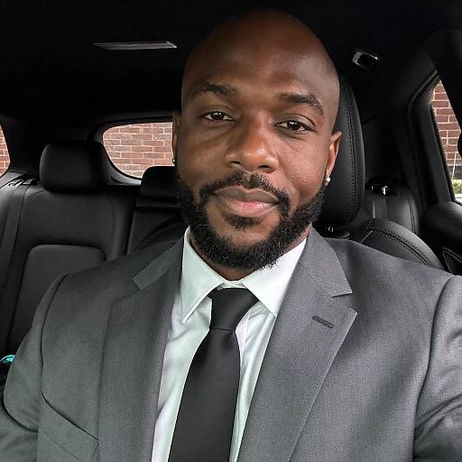 Stylish Bald Man in Dimly Lit Car