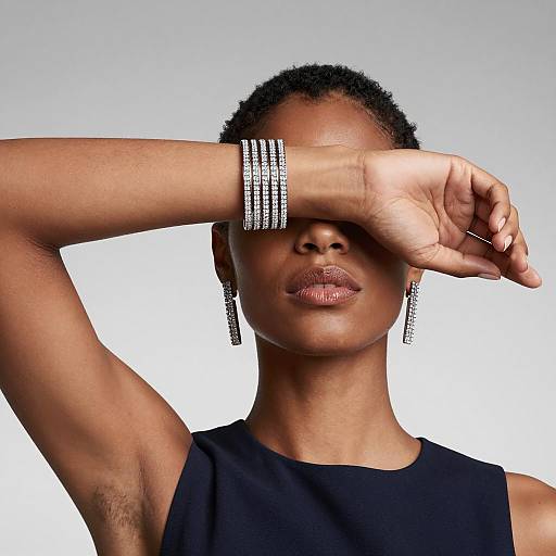 Woman Wearing Diamond Jewelry with Arm Raised