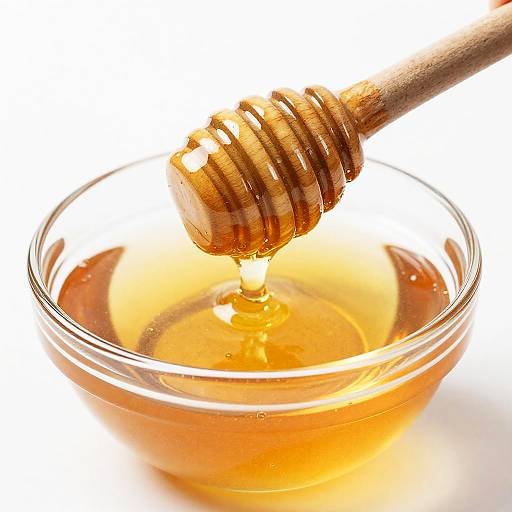 Close-Up of Honey Dipper Dripping Honey