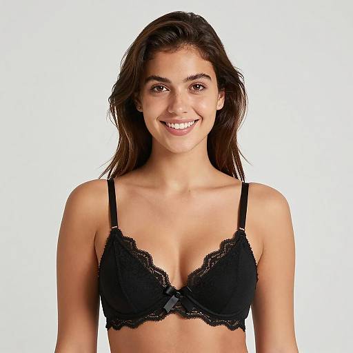 Smiling young woman in black lace bra