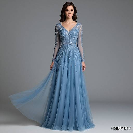 Photograph of a fair-skinned woman with dark brown hair wearing a long, blue, sheer-embellished V-neck gown with long sleeves,