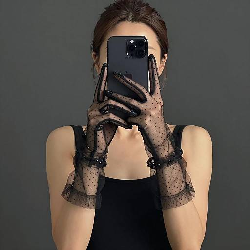 Woman Taking Selfie with Sheer Polka-Dot Gloves