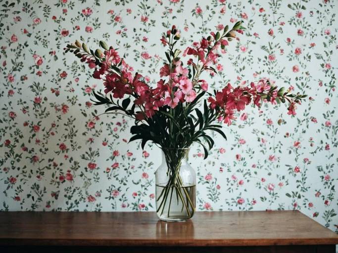 Pink Flowers in Vase with Floral Wallpaper