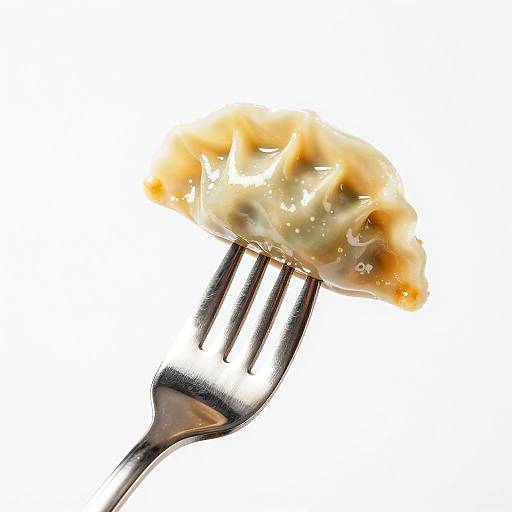 Close-Up of Glazed Dumpling on Fork