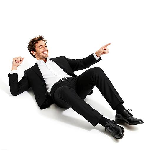 Confident Man in Black Suit Pointing