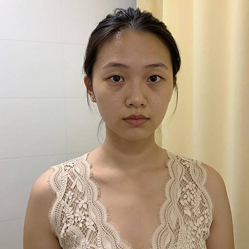 Asian woman in beige lace top