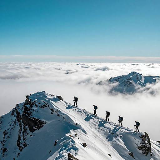 Climbers Ascending Snowy Mountain Ridge