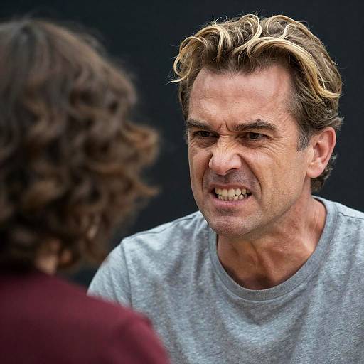 Angry Middle-Aged Man Confronting Another Person