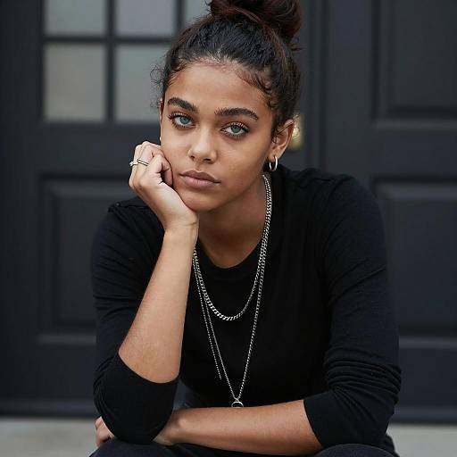 Young Woman in Black Top with Blue-Green Eyes