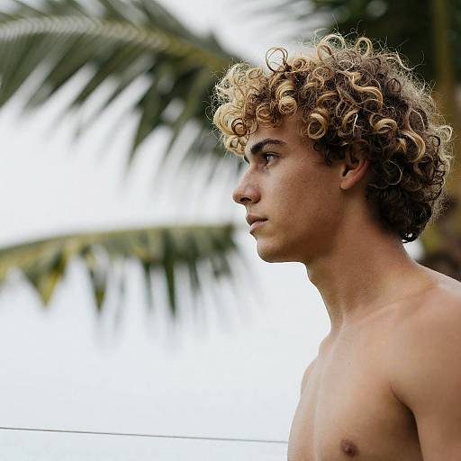 Profile Portrait of Young Man with Curly Hair