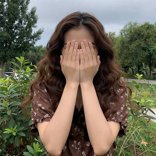 Young Woman in Floral Blouse Outdoors