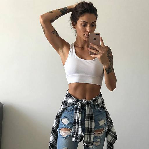 Tattooed Woman Taking Mirror Selfie