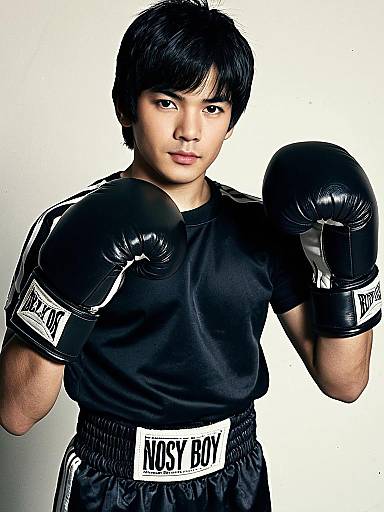 Young Male Boxer in Black Boxing Outfit