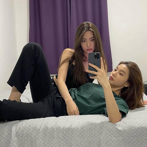 Playful Mirror Selfie Between Friends