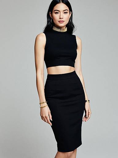 Chic woman in black two-piece outfit