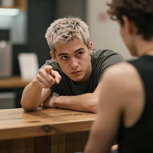 Intense Young Man at a Wooden Counter