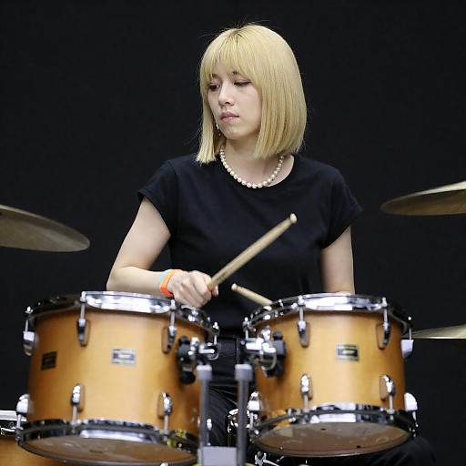 Blonde Woman Playing Yellow Drum Set
