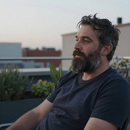 Man with Salt and Pepper Beard on Rooftop Garden