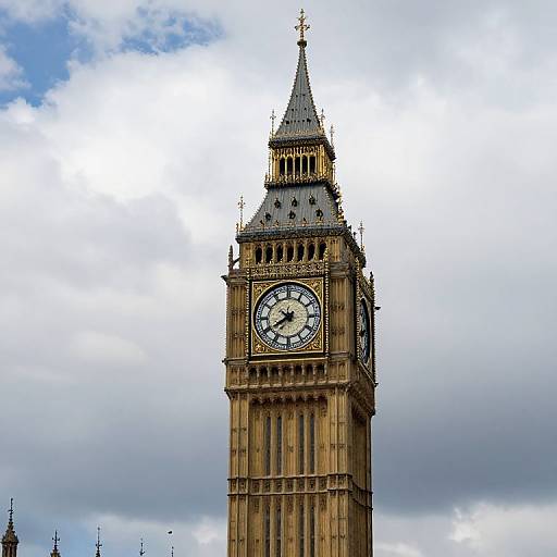 Photograph of London's iconic Big Ben clock tower against a cloudy sky, showcasing its detailed Gothic architecture and prominent clock face.