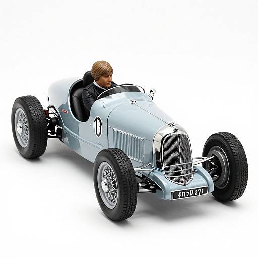 Photorealistic CGI of a silver vintage race car with large black tires, driven by a man with blonde hair, wearing a black jacket, on a