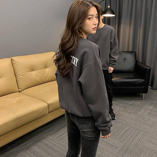 Young woman looking over shoulder indoors