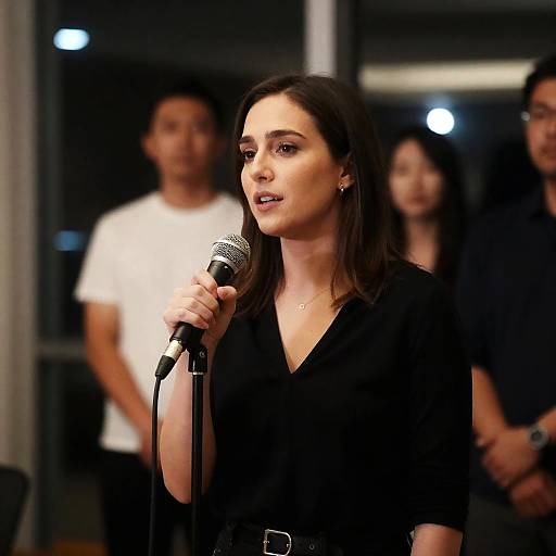 Woman Speaking at Dimly Lit Venue