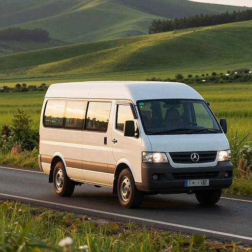 Minibus on Lush Countryside Sunset