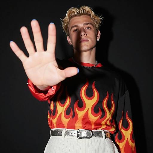 Young Man in Flame-Patterned Top with Hand Extended