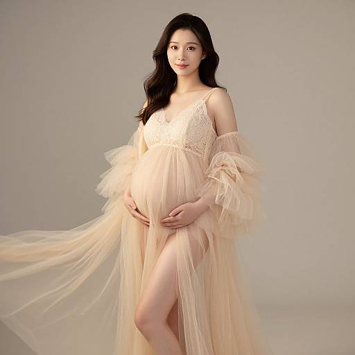 Elegant Pregnant Woman in Tulle Robe