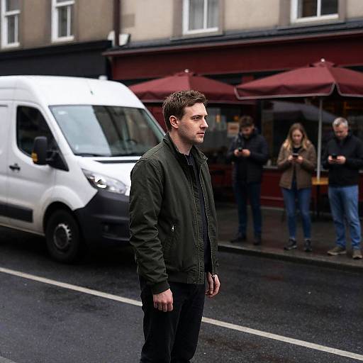 Man on Wet City Street with White Van