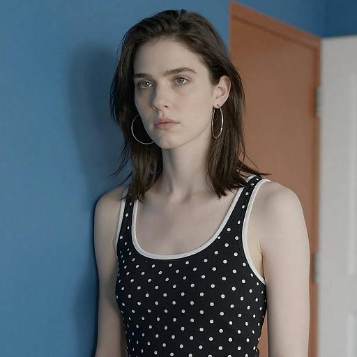 Serious Woman in Polka-Dot Top