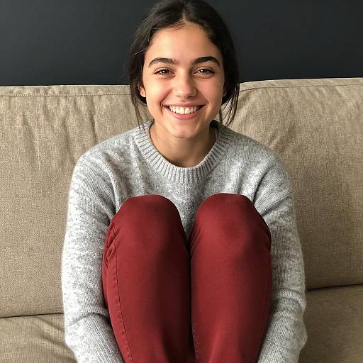 Smiling Young Woman on Beige Couch