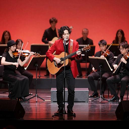 Guitarist on Red Stage with Orchestra