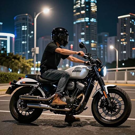 Photograph of a man in a black helmet, black shirt, and jeans riding a white Yamaha motorcycle at night, cityscape with illuminated skyscrapers