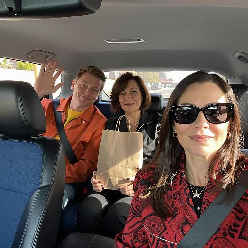 Three people enjoying car ride together