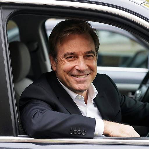 Smiling Businessman in Car Window