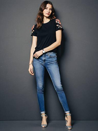 Casual Chic Woman in Floral Embroidered T-Shirt and Skinny Jeans