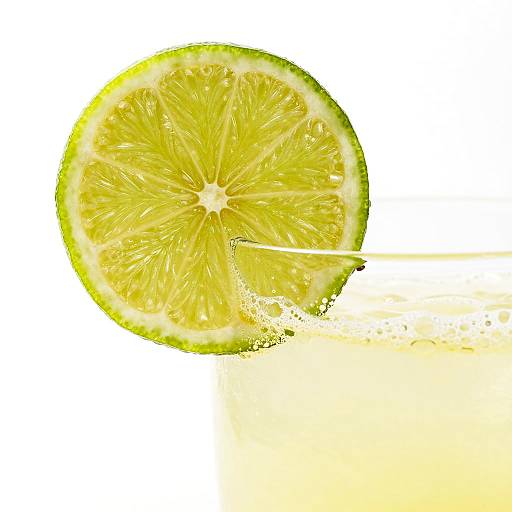Bright Lime Slice on Frothy Glass