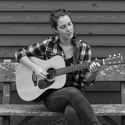 Woman Playing Guitar on Rustic Bench