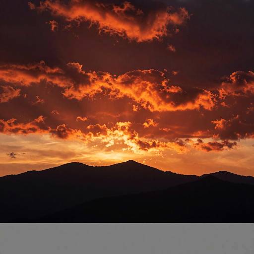 Fiery Sunset Over Silhouetted Mountains