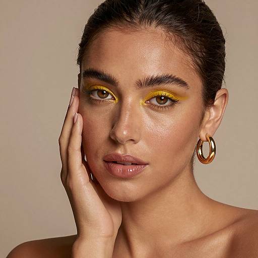 Woman with Yellow Eyeshadow and Gold Hoop Earrings