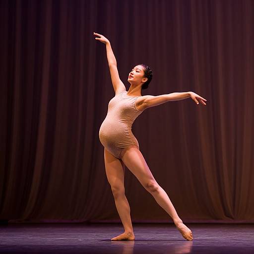 Graceful Pregnant Dancer on Stage