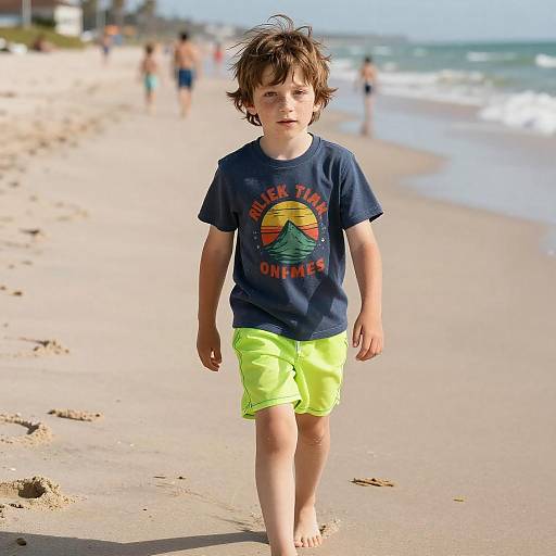 Photograph of a young boy with messy brown hair, wearing a navy 
