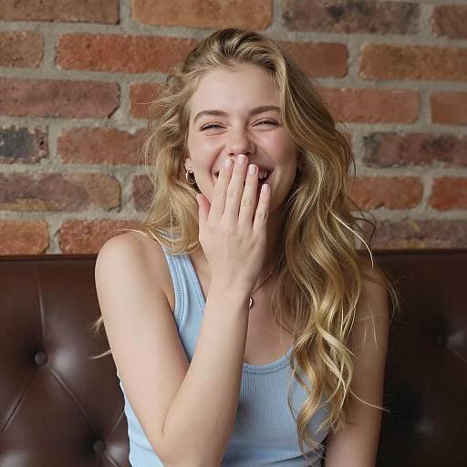 Joyful Blonde Woman Laughing Indoors